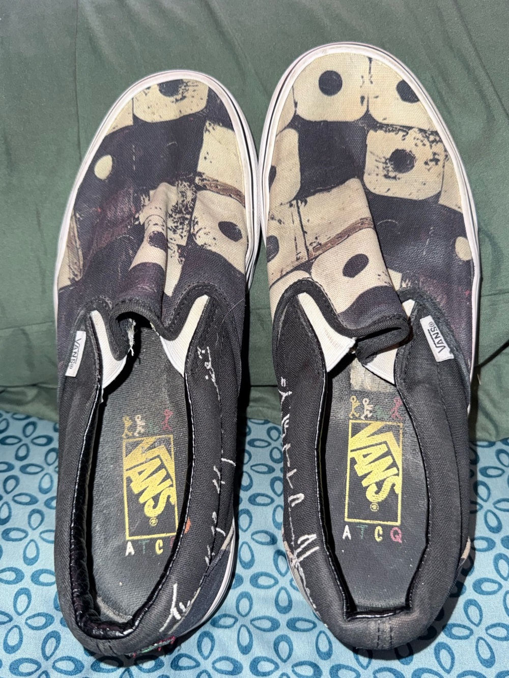 Slip-On Canvas Vans in Black and Cream with Graphic Script